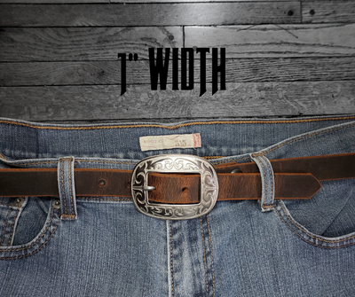 Our ladies 1" wide Distressed Brown water buffalo leather belt with snaps to easily change out buckle. Features a smoothed black burnished and a oval shaped Stainless steel buckle with Western floral pattern around it's oval shape. The buckle size is 3" across x 2 1/4" tall. This belt has a softer feel than some of our Name style belts but still durable. Available online or for purchase at our shop just outside Nashville in Smyrna, TN.