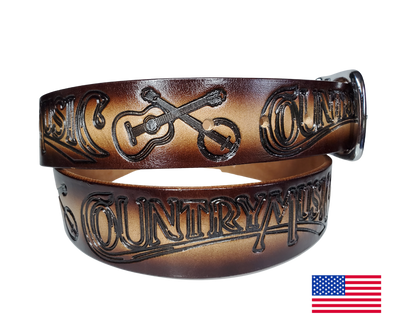 This USA made veg-tan leather belt is approx. 1/8" thick, 1 1/2"width with no fillers to split or rip apart. The belt features Guitar, Banjos with COUNTRY MUSIC embossed around the entire belt. The color has a Dark Brown edge faded into a Natural colored center. The leather is comfortable from day one   Buckle is snapped on for easy buckle change. Colors may vary do to the manufacturing process. We don't make this belt but it's Buckle and Hide approved and still made in the USA. 