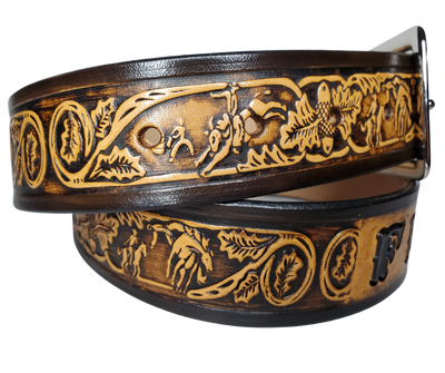 "The Bullrider" is a handmade real leather belt made from a single strip of cowhide shoulder leather that is 8-10 oz. or approx. 1/8" thick. It has hand burnished (smoothed) edges and a western influenced Rodeo events pattern. This belt is completely HAND dyed with a multi step finishing technic. The antique nickel plated solid brass buckle is snapped in place with heavy snaps.  This belt is made just outside Nashville in Smyrna, TN.