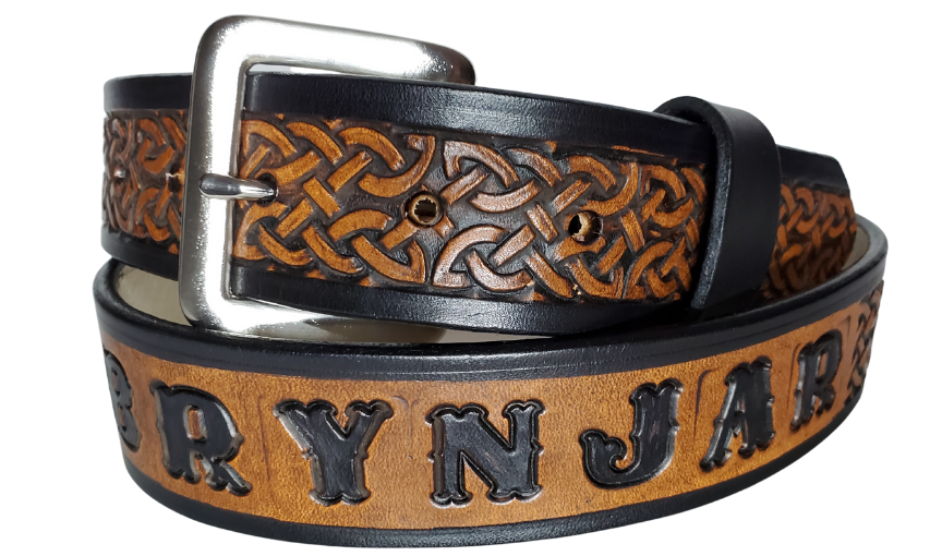 "The Magnus" is a handmade real leather belt made from a single strip of cowhide shoulder leather that is 8-10 oz. or approx. 1/8" thick. It has hand burnished (smoothed) edges and the Classic knotted Celtic pattern. This belt is completely HAND dyed with a multi step finishing technic. The antique nickel plated solid brass buckle is snapped in place with heavy snaps.  This belt is made just outside Nashville in Smyrna, TN.