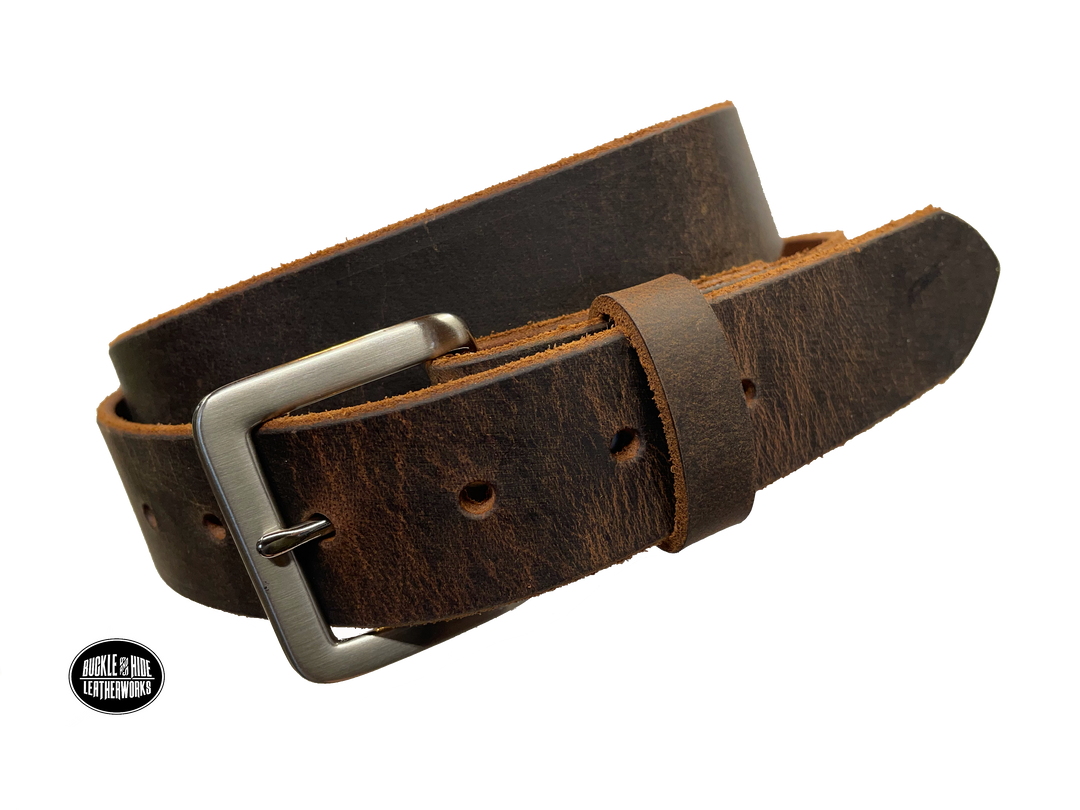 This brown leather belt is made from Crazy Horse tanned leather for that distressed and pull-up look. The edges are beveled and left raw for a contrasting look. It has an antique nickel coated solid brass buckle that is snapped in place. Belt is 1 1/2" wide and available in lengths from 34" to 44".  It is handmade in our shop in Smyrna, TN, just outside of Nashville. Choose Plain or Embossed Stitch pattern.