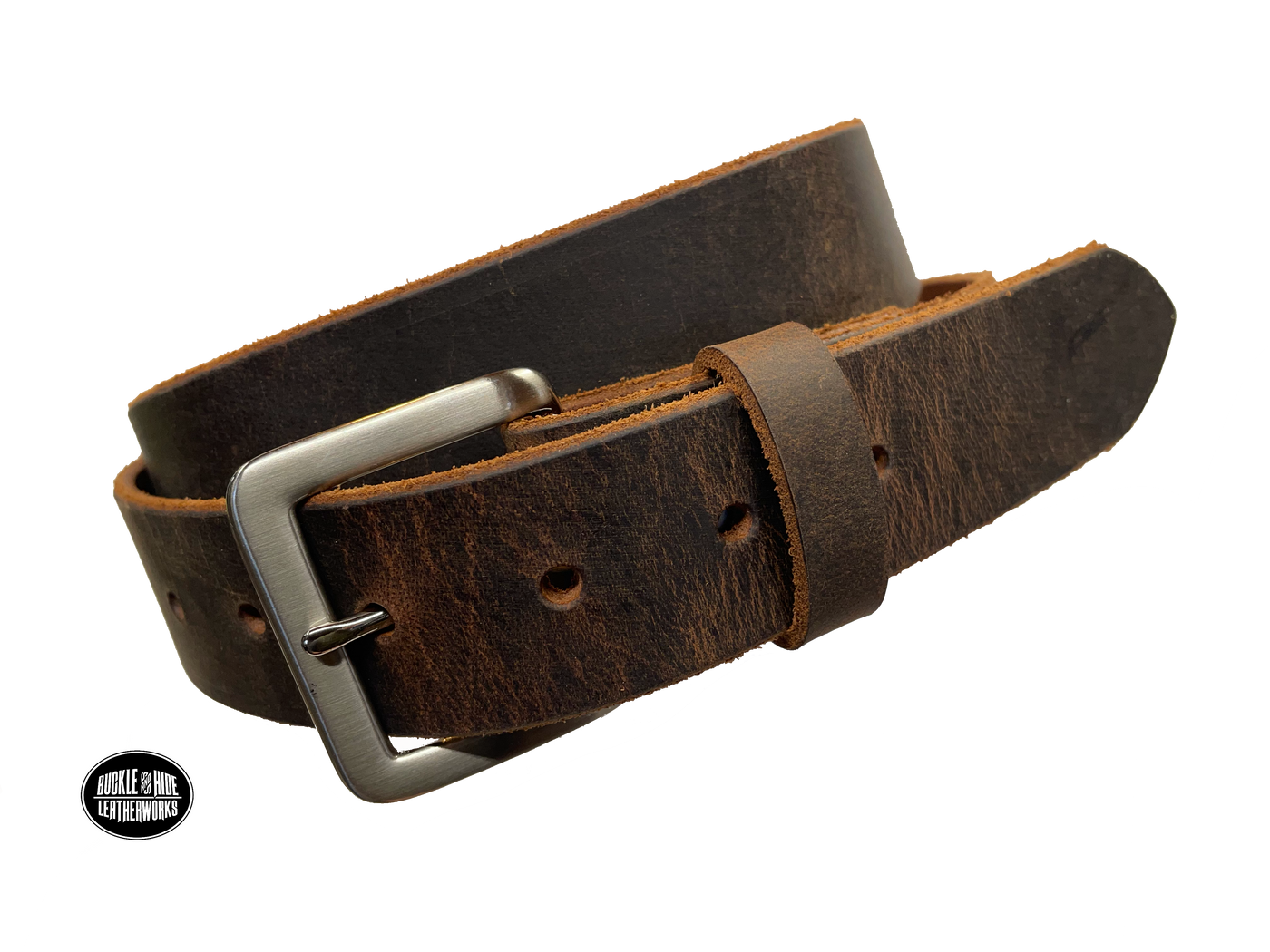 This brown leather belt is made from Crazy Horse tanned leather for that distressed and pull-up look. The edges are beveled and left raw for a contrasting look. It has an antique nickel coated solid brass buckle that is snapped in place. Belt is 1 1/2" wide and available in lengths from 34" to 44".  It is handmade in our shop in Smyrna, TN, just outside of Nashville. Choose Plain or Embossed Stitch pattern.