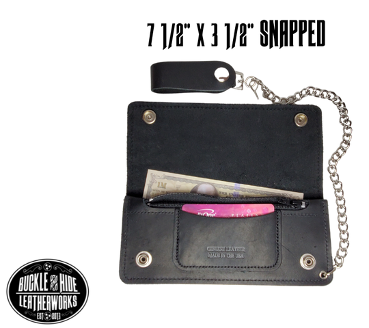 This is the Original Chain Wallet, great for the Modern minimalist. One credit card slot in the front with 2 main cash or whatever your STUFF is....5 year old receipts, concert stub from high school, the stuff you forgot was in there!  Made in USA 2 main Cash compartments 1 card slot Complete with 12" chain  Dimensions: 7 1/2" x 4" folded, 7 1/2" x7 1/2" opened