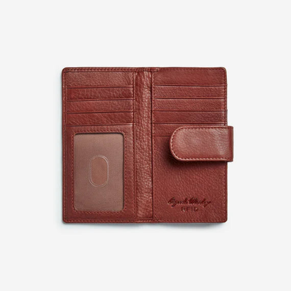 Size: 5.75 x 3  Soft Supple cowhide leather from Argentina. Snap tab closure. Eight card slots,ID window, Two full length slip pockets.  Exterior zip pocket for coins. Nylon lining, RFID lining protects against identity theft.  Pictured in Brandy