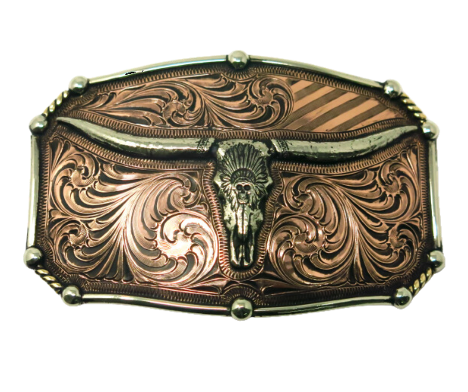 The Chief Longhorn buckle  These buckles are made from German Silver (nickel and brass alloy) or iron metal base. Some buckles have motifs made of copper, iron or brass and some are adorned with synthetic stones. These are all handcrafted. Each piece is punched, cut, soldered, engraved, polished and painted by our talented metal workers.  Available in our Smyrna TN shop. Width 4.5” Height 3”
Fits Standard 1.5” belts