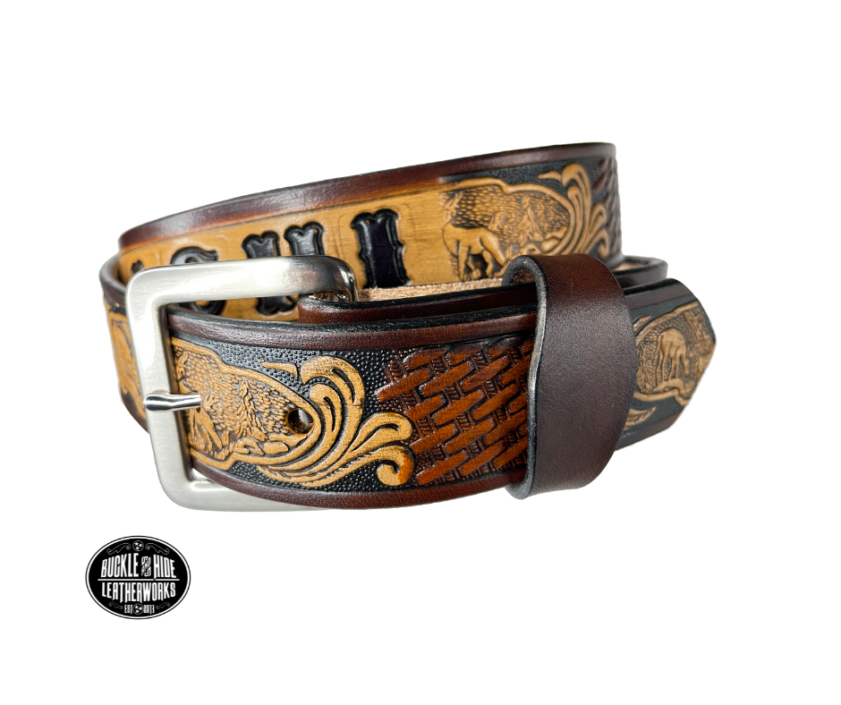 Vegetable tanned cowhide approx. 1/8"thick. Width 1 1/2" and includes Antique Nickle plated Solid Brass buckle Hand dyed BACKGROUND and finished in a TRI TONE FINISH, a multistep process which is where the DELUXE name comes from. Smooth hand burnished painted edges Choose with or without name, if without name, design will cover entire length of belt For name Type name desired on belt in "Type Name Here" section, no more than 8 letters maximum Made in our Smyrna, TN, USA shop