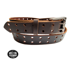 Our double pin roller belt features a single strip of genuine top grain leather. The leather is comfortable from day one and features double holes the entire length of the strap!   The antique nickel plated roller buckle is easy on the leather; the roller functions to protect the strap from undue creasing and scratching.  Buckle is riveted to leather strap. Handmade in our shop just outside Nashville in Smyrna, TN.