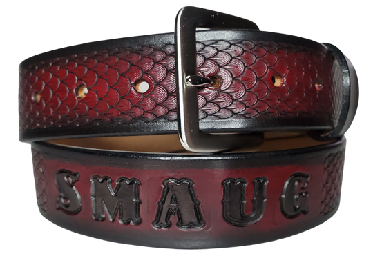 "The Dragon" will take you to the Tolkien fantasy lands with Balrog, Swords, and of course Dragons. This handmade real leather belt made from a single strip of cowhide shoulder leather that is 8-10 oz. or approx. 1/8" thick. It has hand burnished (smoothed) edges and a Dragon Scale pattern. This belt is completely HAND dyed with a multi step finishing technic. The antique nickel plated solid brass buckle is snapped in place with heavy snaps.  This belt is made just outside Nashville in Smyrna, TN.
