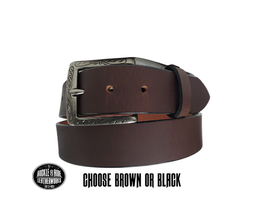 This full grain brown leather belt has a dull look that appears great dressed up or down.  It has beveled, smooth black edges and is handmade in Smyrna, TN just outside Nashville.  The Ornate scroll designed antique silver buckle is snapped in place. Our shop favorite, our customer favorite,. After a short break-in period, this will be the most comfortable casual belt you will ever own.   It is 1 1/2" wide and available in sizes 34" to 44". Choose Black or Brown.