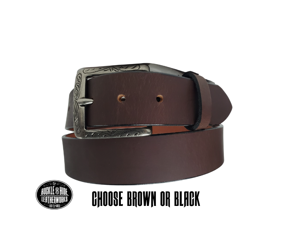 This full grain brown leather belt has a dull look that appears great dressed up or down.  It has beveled, smooth black edges and is handmade in Smyrna, TN just outside Nashville.  The Ornate scroll designed antique silver buckle is snapped in place. Our shop favorite, our customer favorite,. After a short break-in period, this will be the most comfortable casual belt you will ever own.   It is 1 1/2" wide and available in sizes 34" to 44". Choose Black or Brown.