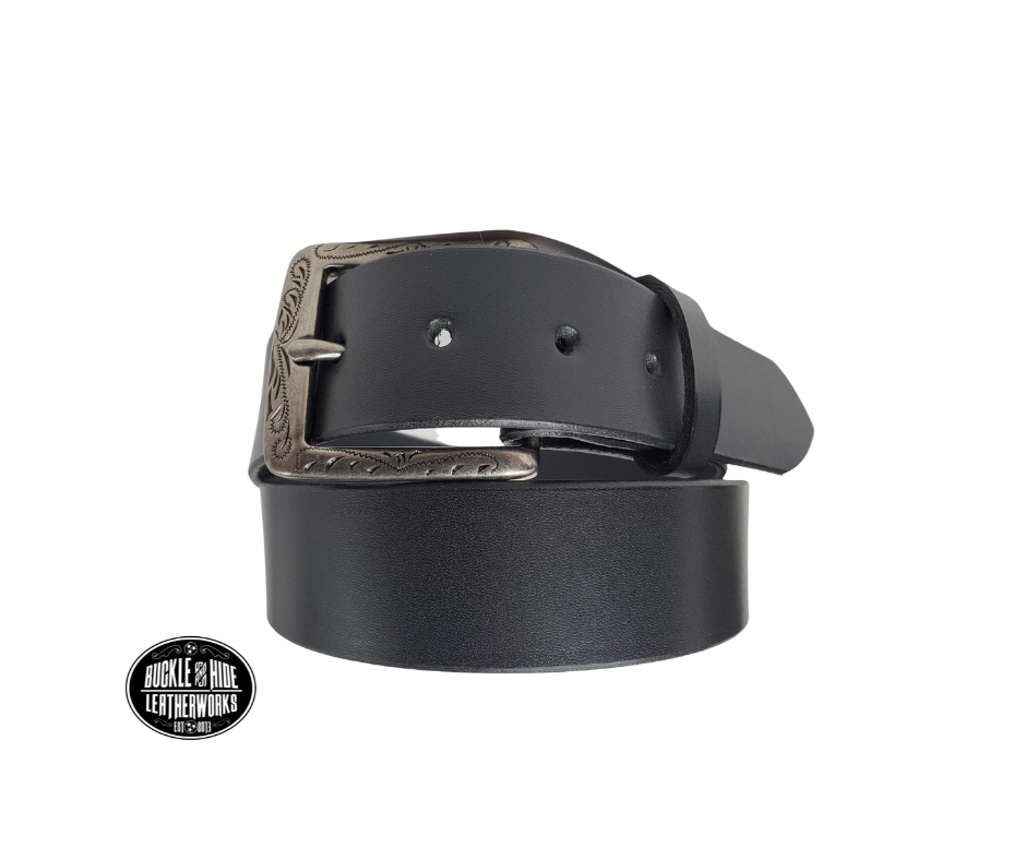 This full grain brown leather belt has a dull look that appears great dressed up or down.  It has beveled, smooth black edges and is handmade in Smyrna, TN just outside Nashville.  The Ornate scroll designed antique silver buckle is snapped in place. Our shop favorite, our customer favorite, After a short break-in period, this will be the most comfortable casual belt you will ever own.  It is 1 1/2" wide and available in sizes 34" to 44". Choose Black or Brown.