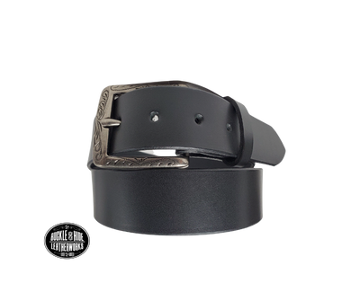 This full grain brown leather belt has a dull look that appears great dressed up or down.  It has beveled, smooth black edges and is handmade in Smyrna, TN just outside Nashville.  The Ornate scroll designed antique silver buckle is snapped in place. Our shop favorite, our customer favorite, After a short break-in period, this will be the most comfortable casual belt you will ever own.  It is 1 1/2" wide and available in sizes 34" to 44". Choose Black or Brown.