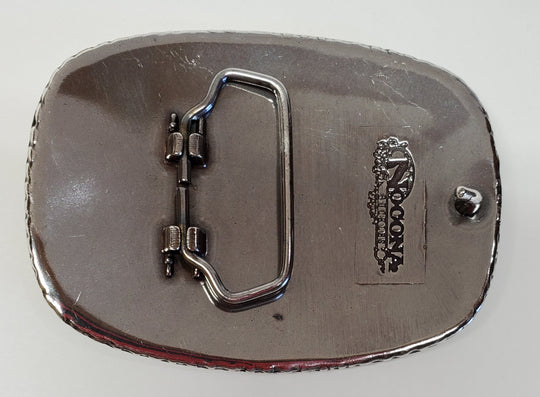 Nocona Rectangular Western Buckle back-This rectangular shaped buckle by Nocona has rounded edges with rope design around the border. It is chrome colored with scroll design etched appearance on surface.  Measures 2 3/4" tall by 3 3/4" wide and fits belts up to 1 1/2" wide.  It is available for purchase in our retail shop in Smyrna, TN, just outside Nashville and also on the online store. Made in Taiwan. 