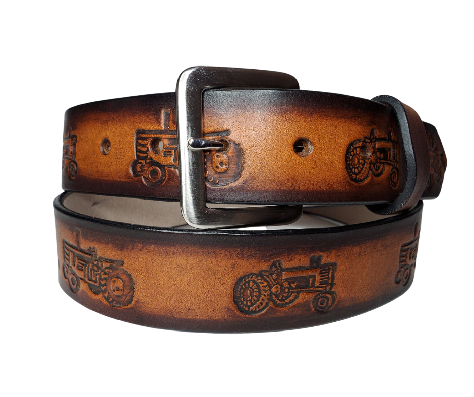 "The FERGUSON" is a handmade real leather belt made from a single strip of cowhide shoulder leather that is 8-10 oz. or approx. 1/8" thick. It has hand burnished (smoothed) edges and a Farm scene pattern. This belt is completely HAND dyed with a multi step finishing technic. The antique nickel plated solid brass buckle is snapped in place with heavy snaps.  This belt is made just outside Nashville in Smyrna, TN.