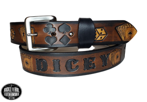 "The Gambler" is a handmade real leather belt made from a single strip of cowhide shoulder leather that is 8-10 oz. or approx. 1/8" thick. It has hand burnished (smoothed) edges and Aces, Eights, Dice, Clubs, Diamonds, Spade pattern down the center. This belt is completely HAND dyed with a multi step finishing technic. The antique nickel plated solid brass buckle is snapped in place with heavy snaps.  This belt is made just outside Nashville in Smyrna, TN.