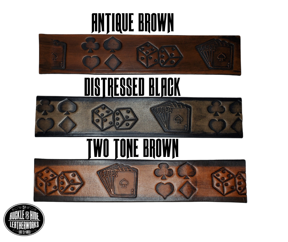"The Gambler" is a handmade real leather belt made from a single strip of cowhide shoulder leather that is 8-10 oz. or approx. 1/8" thick. It has hand burnished (smoothed) edges and Aces, Eights, Dice, Clubs, Diamonds, Spade pattern down the center. This belt is completely HAND dyed with a multi step finishing technic. The antique nickel plated solid brass buckle is snapped in place with heavy snaps.  This belt is made just outside Nashville in Smyrna, TN.