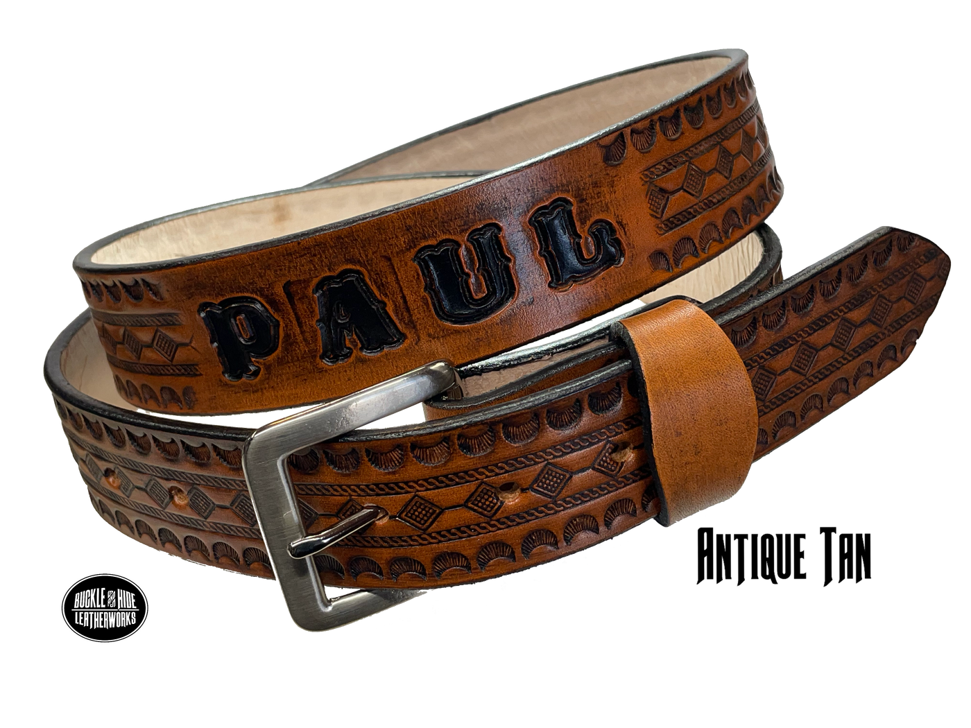Full grain American vegetable tanned cowhide approx. 1/8"thick. Width 1 1/2" and includes Antique Nickle plated Solid Brass buckle Hand Finished in 3 color options Smooth burnished painted edges Choose with or without name, if without name, design will cover entire length of belt For name Type name desired on belt in "Type Name Here" section, no more than 8 letters maximum Buckle snaps in place for easy changing if desired Made in our Smyrna, TN, USA shop