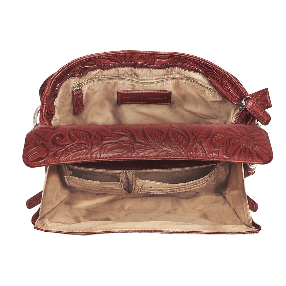 Tooled American Cowhide Clutch W/Carry Conceal Compartment. Designed for either Left or Right handed use, CCW special outside back compartment zips open on 3 sides, Special padding to prevent imprinting, Adjust holster to your comfort draw angle, Choose Black, Tan or Cherry. These are typically in-stock in our retail store in Smyrna, TN. not far from Nashville. Call for current stock.