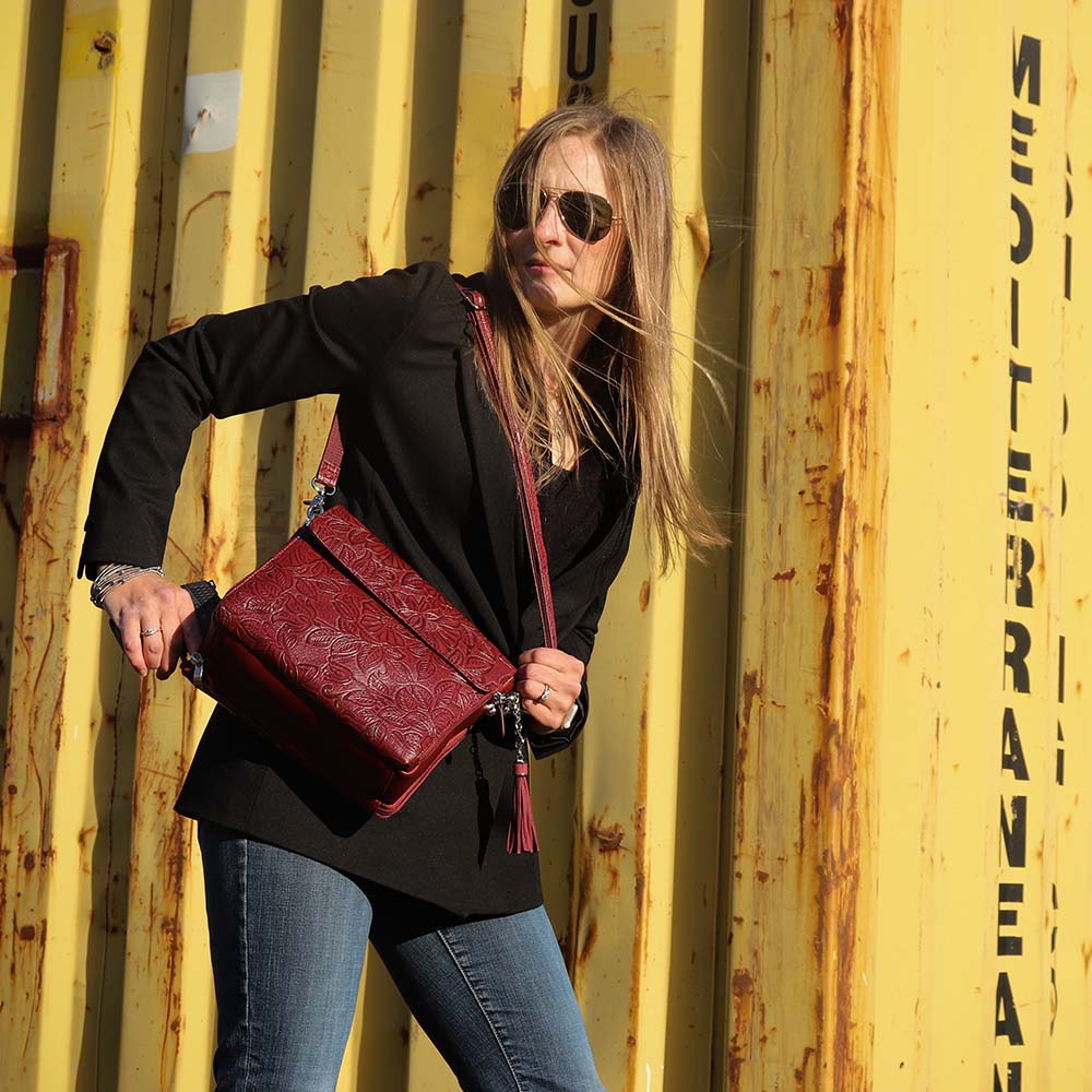 Tooled American Cowhide Clutch W/Carry Conceal Compartment. Designed for either Left or Right handed use, CCW special outside back compartment zips open on 3 sides, Special padding to prevent imprinting, Adjust holster to your comfort draw angle, Choose Black, Tan or Cherry. These are typically in-stock in our retail store in Smyrna, TN. not far from Nashville. Call for current stock.