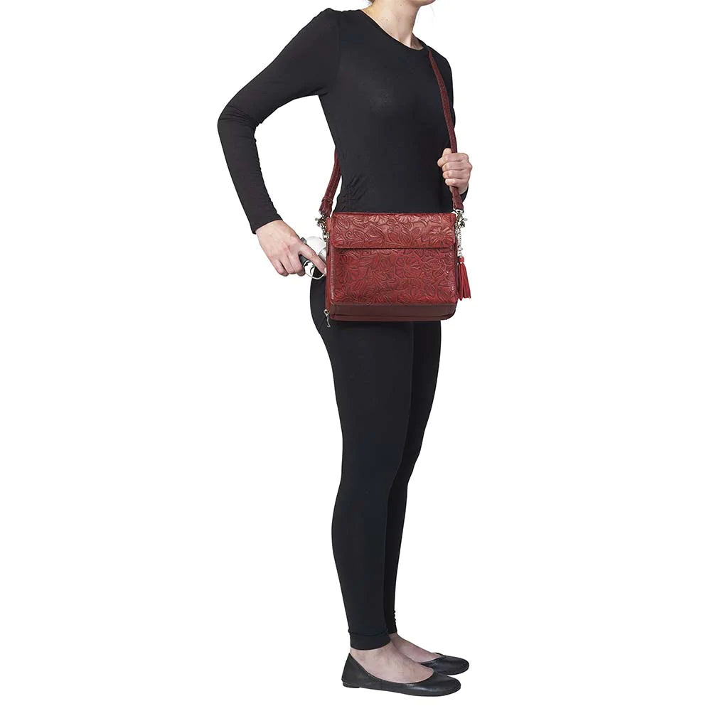 Tooled American Cowhide Clutch W/Carry Conceal Compartment. Designed for either Left or Right handed use, CCW special outside back compartment zips open on 3 sides, Special padding to prevent imprinting, Adjust holster to your comfort draw angle, Choose Black, Tan or Cherry. These are typically in-stock in our retail store in Smyrna, TN. not far from Nashville. Call for current stock.