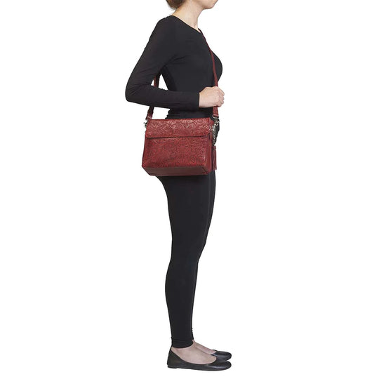 Tooled American Cowhide Clutch W/Carry Conceal Compartment. Designed for either Left or Right handed use, CCW special outside back compartment zips open on 3 sides, Special padding to prevent imprinting, Adjust holster to your comfort draw angle, Choose Black, Tan or Cherry. These are typically in-stock in our retail store in Smyrna, TN. not far from Nashville. Call for current stock.