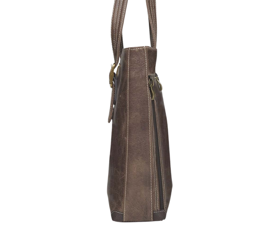 Distressed Vintage Tanned Full Grain Buffalo Leather. The more leather is used, day after day, the better it gets. Rich distressed patina comes with age Wonderfully soft from oils infused in tanning process. Designed for either Left or Right handed use Special padding to prevent gun imprinting.   SLASH RESISTANT SHOULDER STRAP Ply steel wire tastefully reinforced Cross Body length Easily clips on or off. 