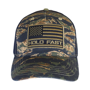 Share your faith in America with this bold take on camouflage. Our “Tiger Stripe Camo” Cap by HOLD FAST® offers a rugged blend of patriotism and jungle style. The flag of the United States of America is worthy of celebration! We can stand up for our flag because of the sacrifice of those who serve in the United States Armed Forces, and ultimately because of the sacrifice of our Lord and Savior, Jesus Christ, on the cross at Calvary. One size fits most.
