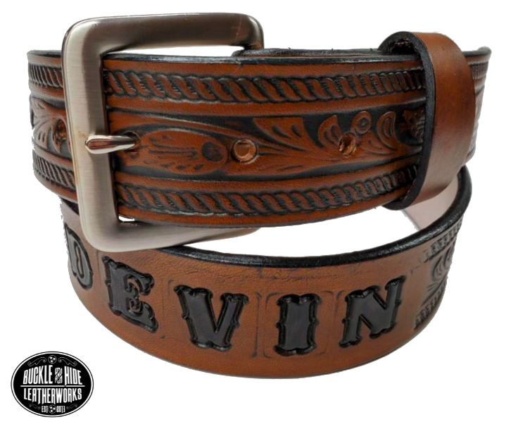 Be the star of the show with our "High Noon" Western Name Veg tan Leather Belt! Made with Veg tan cowhide in our Smyrna TN  shop just 20 miles outside of Nashville. It's designed for comfort and durability. Add a personalized name and change the buckle any time, all in 1 1/2" width of classic western style! Saddle up and get yours today!