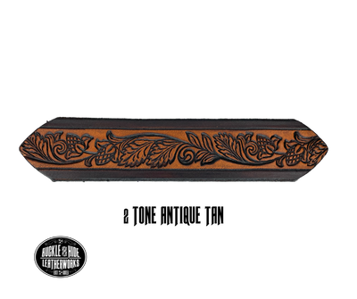 This solid strip of Veg Tan cowhide, is hand stained in 3 brown options, with smooth, finished edges. Embossed with Western Vine down length of belt, or have name added to scene up to 8 letters. Belt thickness is approx. 1/8", and 1 1/2" wide. Sizes available are 34" to 44" from buckle end to hole most worn. Attached with 2 snaps is a Brushed Nickel plated solid brass buckle. 