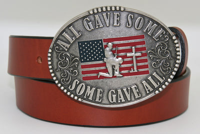 All Gave Some Some Gave All Buckle oval plate style belt buckle with American Flag inlay under kneeling soldier and cross. All Gave Some, Some Gave All imprinted around edges of buckle and scroll design on either side of wording. Available in our shop just outside Nashville in Smyrna, TN as well as on this website.  Made by AndWest in Mexico. Dimensions are 3 1/4" by 4 1/4", pictured on sturdy brown leather belt, also available from this shop.