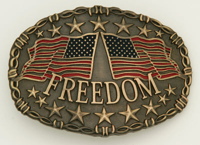 Freedom Belt buckle-This Freedom belt buckle by And West features 2 American Flags, one flying left and the other toward the right.  Freedom is printed across bottom of buckle and raised stars are featured along the top and bottom of this oval shaped buckle. Barbed wire design surrounds border of buckle. Color is Antique brass look with red and blue flag colors. Available in our online shop and in the retail shop in Smyrna,TN, just outside Nashville. Measures 3" tall by 4" wide. Made in Mexico.