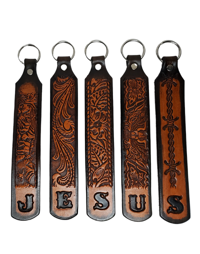 Our Customizable "1975" Longer Leather keychain embossed similar to our popular belts. Great for identifying luggage, backpacks, or your keys! Available in the below choices All colored in our popular 2 TONE BROWN, pick one or a few. Made in our Smyrna, TN shop. Please type desired name in CUSTOM box. Measures...approx. 1" x 7"