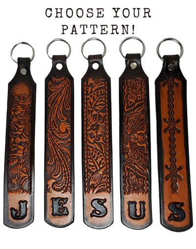 Our Customizable "1975" Longer Leather keychain embossed similar to our popular belts.  Great for identifying luggage, backpacks, or your keys! Available in the below choices All colored in our popular 2 TONE BROWN, pick one or a few. Made in our Smyrna, TN shop. Please type desired name in CUSTOM box.   Measures...approx. 1" x 7"