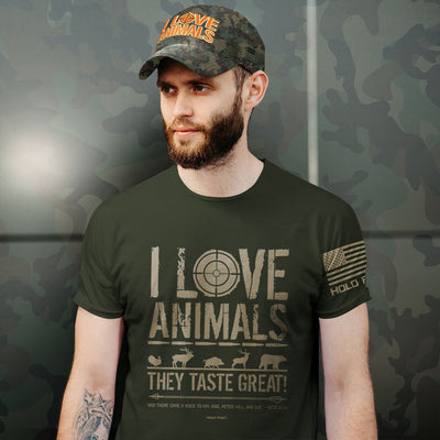 Get in the hunt with this HOLD FAST® Men’s Christian T-Shirt in City Green. Killing animals is controversial in our modern culture, but properly seen against Scripture, we learn that God provided meat for us as a way to feed our families. We are designed to be carnivores, and to eat tasty animals to live. Limited sizes remain, only one left for sizes S, L, & 3X. Available online and in our retail shop in Smyrna, TN. Photo of shirt and hat being worn.
