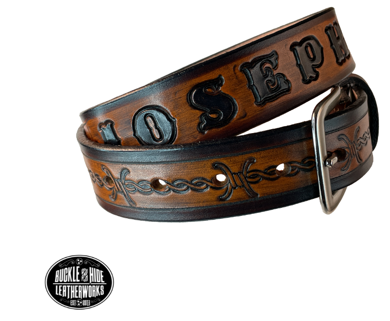 Our "Kid's Barbwire" is just like the Riding Fence' for dad or mom. Full grain American vegetable tanned cowhide approx. 1/8"thick. Width is 1 1/4" and includes Antique Nickle plated Solid Brass buckle. We Hand Finish with each belt. Edges are smooth burnished painted edges. Made in our Smyrna, TN, USA shop. Buckle snaps in place for easy changing if desired. Choose with or without name, if without name, design will cover entire length of belt.