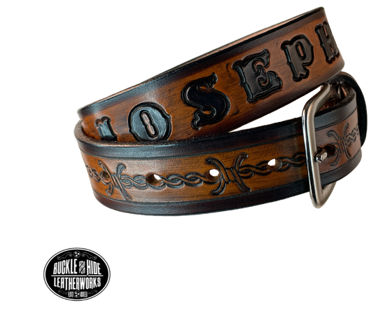 Our "Kid's Barbwire" is just like the Riding Fence' for dad or mom. Full grain American vegetable tanned cowhide approx. 1/8"thick. Width is 1 1/4" and includes Antique Nickle plated Solid Brass buckle. We Hand Finish with each belt. Edges are smooth burnished painted edges. Made in our Smyrna, TN, USA shop. Buckle snaps in place for easy changing if desired. Choose with or without name, if without name, design will cover entire length of belt.