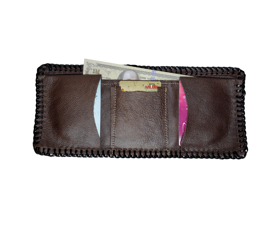Here's a long time favorite, the Classic laced wallet. These have been around for years and the only wallet some will use. Hand laced with plastic and made from garment leather they are soft and pliable. The inside layout and COLOR will vary, pictured is the most common inside layout. Choose PLAIN Black or PLAIN brown.