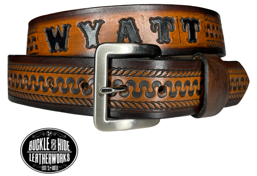 This belt's got some class! Embossed with a classic western serpentine/rope pattern and made with 1/8" thick Veg tan cowhide, the "Law Dawg" Name Leather Belt will give you the durability and style to last for miles and miles if you get a bit rowdy - It's made in our Smyrna, TN shop just outside Nashville, TN. Saddle up!