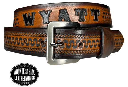 This belt's got some class! Embossed with a classic western serpentine/rope pattern and made with 1/8" thick Veg tan cowhide, the "Law Dawg" Name Leather Belt will give you the durability and style to last for miles and miles if you get a bit rowdy - It's made in our Smyrna, TN shop just outside Nashville, TN. Saddle up!
