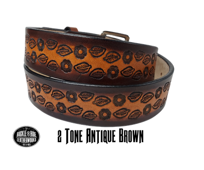 The Lily of the Valley handmade all leather belt is made from a single strip of Veg-Tan cowhide that is a hand finished Veg-tan that is 9-10 oz., or approx. 1/8" thick and is 1 1/2" thick. It has an Vintage style embossed design that is never out of style!  The antique nickel plated solid brass buckle is snapped in place. This belt is made just outside Nashville in Smyrna, TN. Perfect for casual and dress wear, it can be for personal use or for groomsman gifts or other gifts as well. 
