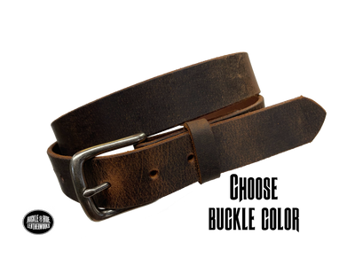 This is a full grain, solid leather, brown Water Buffalo belt with a distressed look and beveled smooth edges. The strap is 1 1/4" wide, approximately 1/8" thick, in sizes from 34" to 44" from buckle end to hole most worn. You may choose the buckle with either an antique brass finish or an antique silver finish. The buckle is held in place with 2 snaps for easy buckle change. Great for everyday wear or casual office dress. Handmade in our Smyrna, TN shop, just outside Nashville.