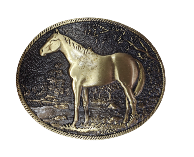 This is the buckle for Horse lovers everywhere. Antiqued brass colored Standing Horse Attitude buckle.  Standard 1.5 belt swivel Available at our shop just outside Nashville in Smyrna, TN. Dimensions: Width 4.00" Height 3.25" Length 0.80"