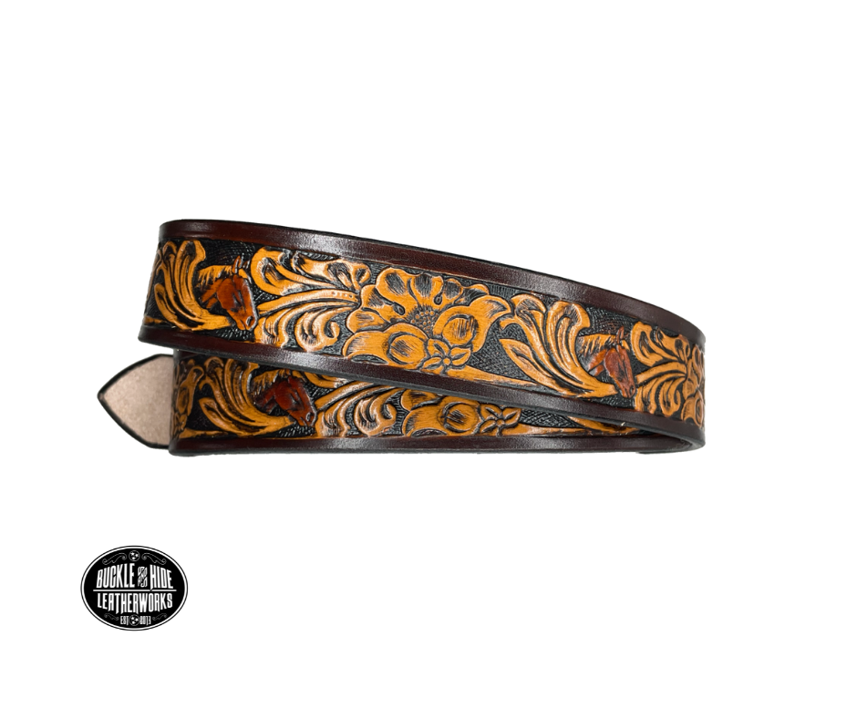 Vegetable tanned cowhide approx. 1/8"thick. Width 1 1/2" and includes Antique Nickle plated Solid Brass buckle Hand dyed BACKGROUND and finished in a TRI TONE FINISH, a multistep process which is where the DELUXE name comes from. Smooth hand burnished painted edges Choose with or without name, if without name, design will cover entire length of belt For name Type name desired on belt in "Type Name Here" section, no more than 8 letters maximum  Made in our Smyrna, TN, USA shop