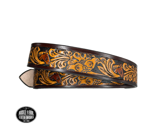 Vegetable tanned cowhide approx. 1/8"thick. Width 1 1/2" and includes Antique Nickle plated Solid Brass buckle Hand dyed BACKGROUND and finished in a TRI TONE FINISH, a multistep process which is where the DELUXE name comes from. Smooth hand burnished painted edges Choose with or without name, if without name, design will cover entire length of belt For name Type name desired on belt in "Type Name Here" section, no more than 8 letters maximum  Made in our Smyrna, TN, USA shop