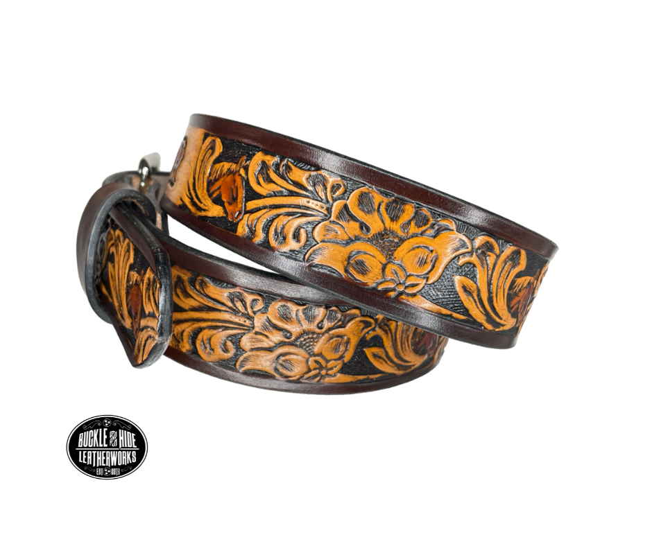 Vegetable tanned cowhide approx. 1/8"thick. Width 1 1/2" and includes Antique Nickle plated Solid Brass buckle Hand dyed BACKGROUND and finished in a TRI TONE FINISH, a multistep process which is where the DELUXE name comes from. Smooth hand burnished painted edges Choose with or without name, if without name, design will cover entire length of belt For name Type name desired on belt in "Type Name Here" section, no more than 8 letters maximum  Made in our Smyrna, TN, USA shop