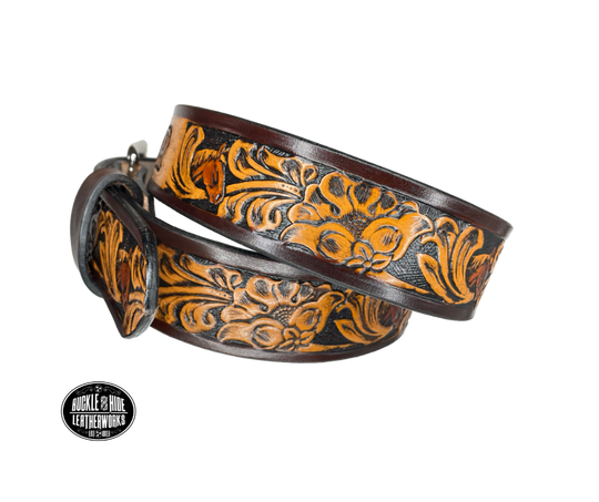 Vegetable tanned cowhide approx. 1/8"thick. Width 1 1/2" and includes Antique Nickle plated Solid Brass buckle Hand dyed BACKGROUND and finished in a TRI TONE FINISH, a multistep process which is where the DELUXE name comes from. Smooth hand burnished painted edges Choose with or without name, if without name, design will cover entire length of belt For name Type name desired on belt in "Type Name Here" section, no more than 8 letters maximum  Made in our Smyrna, TN, USA shop