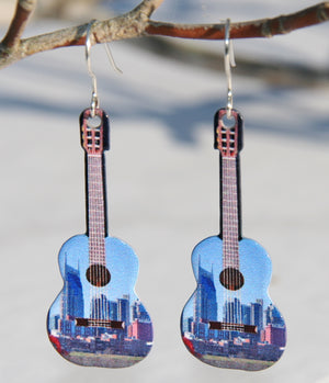 Nashville Guitar Earrings-Downtown Nashville on Acoustic Guitar shaped earrings. Made from a photo we took in 2016. The backs looks like the wood on the back of real guitar. Made in USA by D'ears. Sold exclusively by our shop online or in our retail shop in Smyrna, TN.