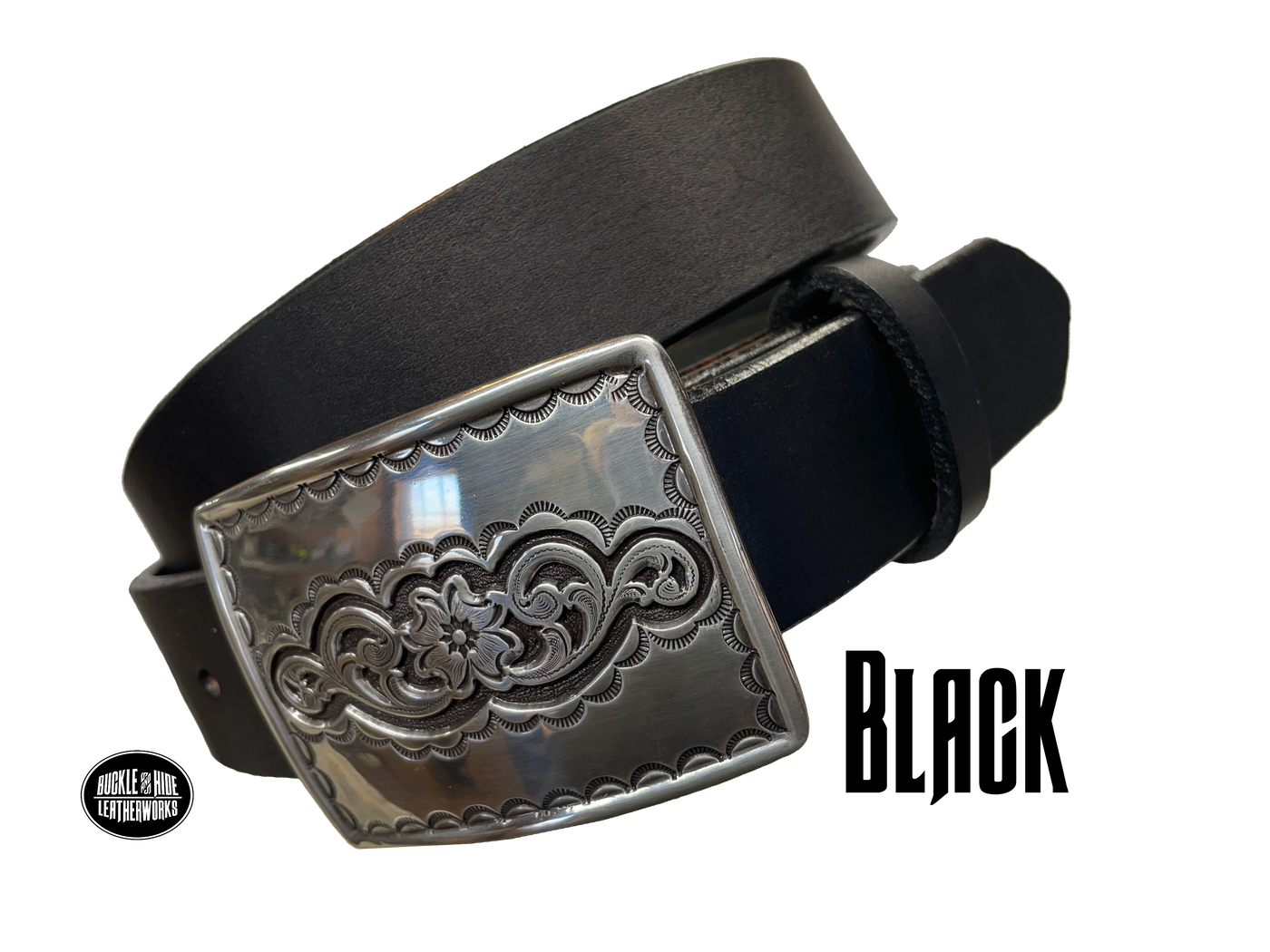 Rectangular antique silver belt buckle with western style tooling, size approx. 3" wide by 2 1/2" tall. Belt is handmade from a single strip of leather in our shop. Belt colors available are distressed brown, black, and dark brown. Buckle snaps in place for easy changing if desired.﻿ CHOOSE ONE BELT STRIP COLOR! Available online and at our shop just outside Nashville in Smyrna, TN. Black belt.