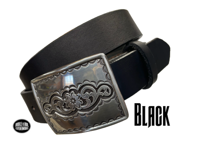 Rectangular antique silver belt buckle with western style tooling, size approx. 3" wide by 2 1/2" tall. Belt is handmade from a single strip of leather in our shop. Belt colors available are distressed brown, black, and dark brown. Buckle snaps in place for easy changing if desired.﻿ CHOOSE ONE BELT STRIP COLOR! Available online and at our shop just outside Nashville in Smyrna, TN. Black belt.