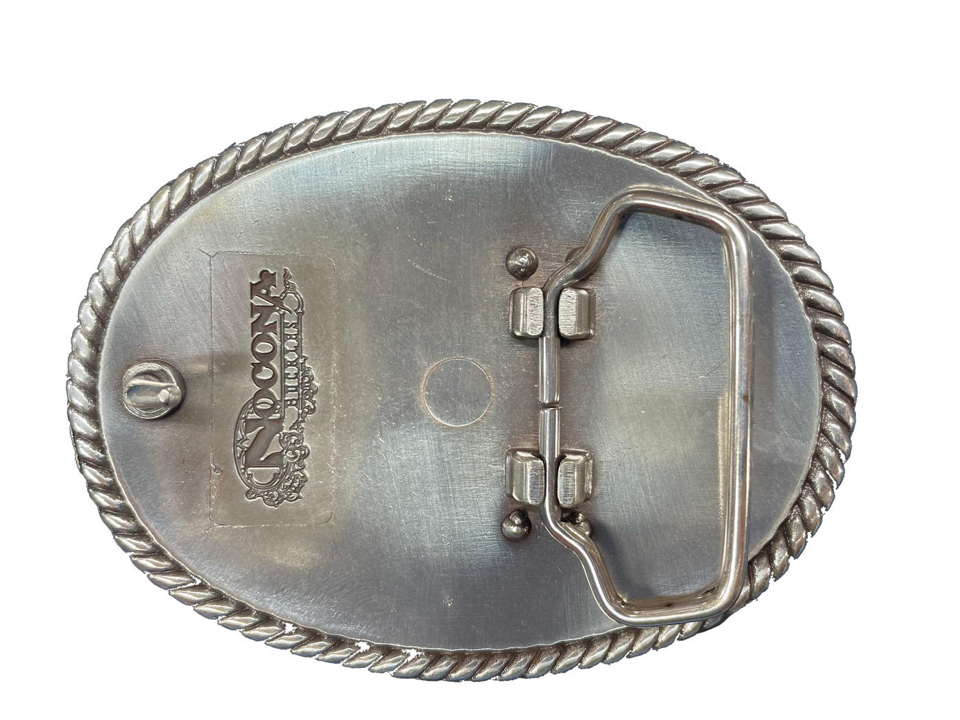 This oval shaped buckle by Nocona has a rope design around the border. It is chrome colored with scroll design etched appearance on surface.  Measures 2 3/4" tall by 3 3/4" wide and fits belts up to 1 1/2" wide.  It is available for purchase in our retail shop in Smyrna, TN, just outside Nashville and also on our online store. Made in Taiwan. Back of buckle pictured.